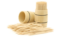 Toothpicks In Wooden Barrels On A White Background