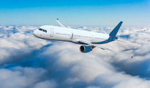 Passenger Airliner Flight In The Blue Sky