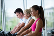 © .shock - friends  exercising on a treadmill at the bright modern gym