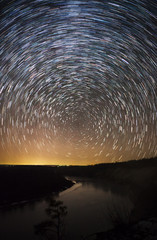Wall Mural - a beautiful night sky, milky way, star trails and the trees