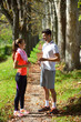 © blicsejo - Young couple jogging in park at morning. Health and fitness.