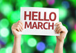 Hello March card with colorful background with defocused lights