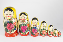Seven Traditional Russian Nesting Dolls Descending In A Row