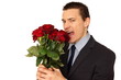 © petrdlouhy - Hungry young man in suit wants eat flowers of roses