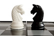 Confrontation of black and white knights on the chessboard