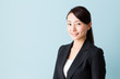 © taka - asian businesswoman on blue background