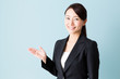 © taka - asian businesswoman on blue background