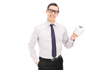 Wall Mural - Young businessman holding a toilet paper roll