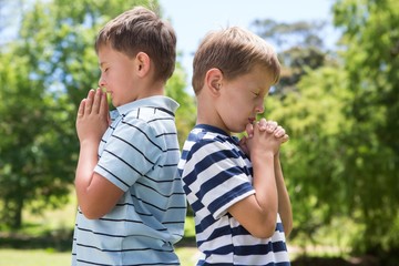 Poster - Little boys praying in the park