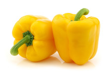 Two Yellow Bell Peppers (capsicum) On A White Background