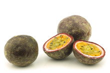 Two Passion Fruit And Two Halves On A White Background