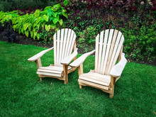 Wooden Chairs On Green Lawn