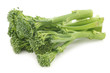 A small form of broccoli, called bimi, on a white background