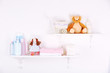 © Africa Studio - Baby accessories on shelves close-up