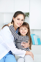 Wall Mural - Little girl and young doctor in hospital