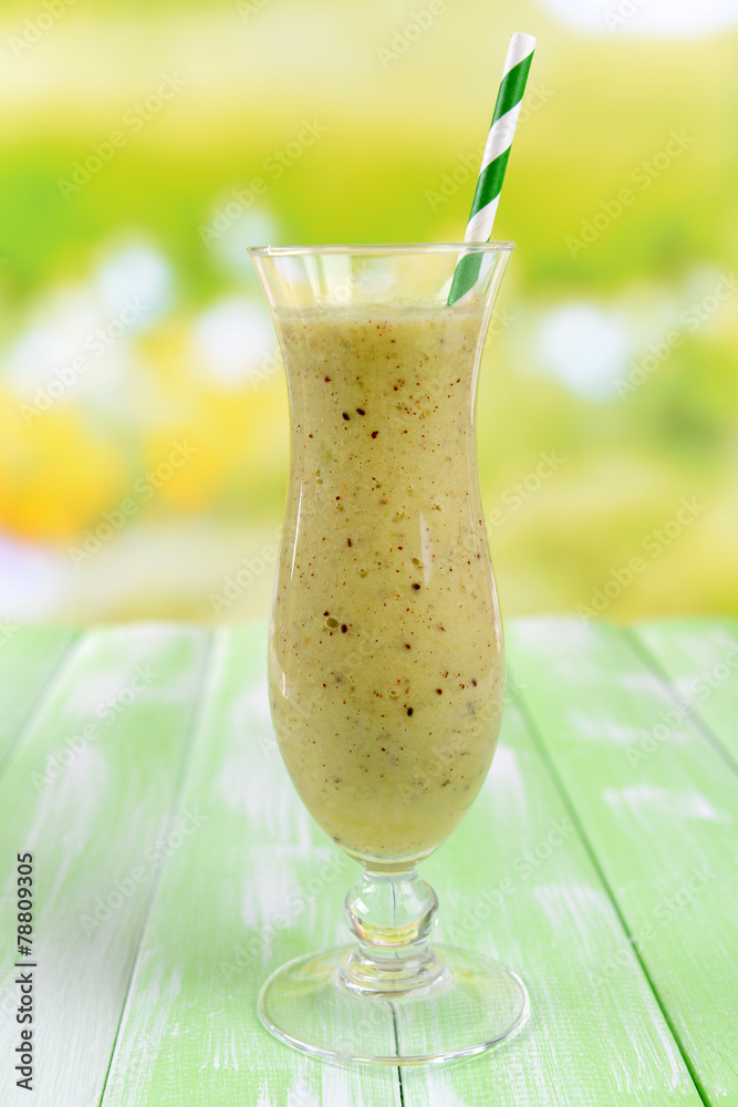 Delicious berry cocktail on table on bright background