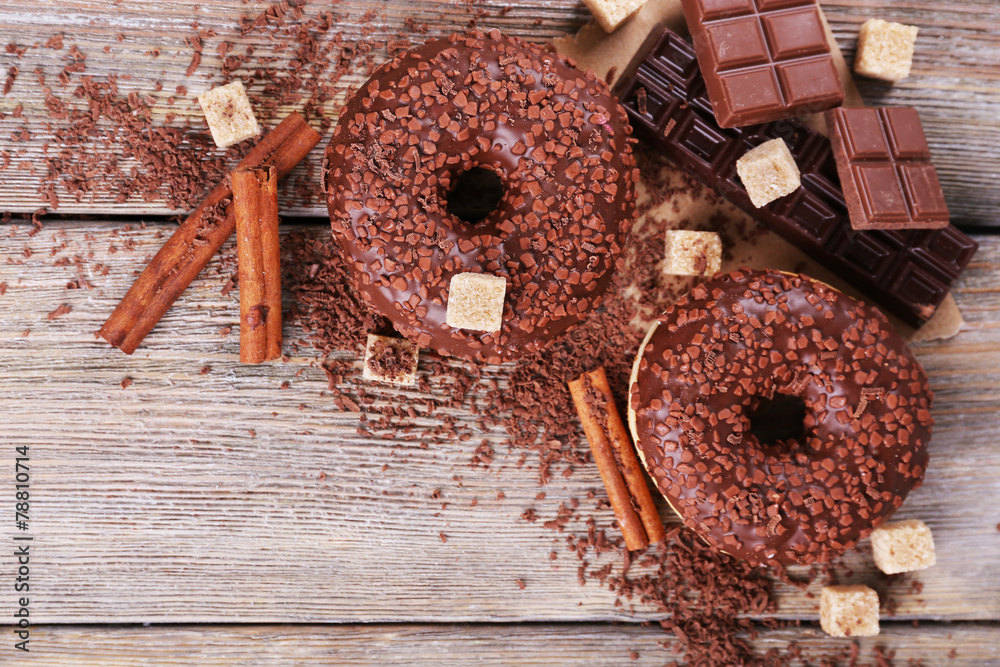 Delicious donuts with icing and chocolate crumb