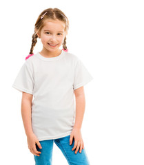 Wall Mural - cute little girl in a white T-shirt and blue jeans