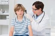 © WavebreakMediaMicro - Doctor examining a little boy with otoscope