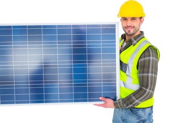 Poster - Handyman in protective clothing carrying solar panel