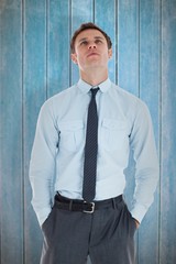 Poster - Serious businessman standing with hands in pocket