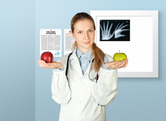 female doctor with two apples