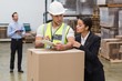 © WavebreakmediaMicro - Warehouse manager and worker looking at clipboard