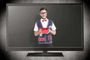 Aufkleber - Composite image of geeky hipster offering christmas gift