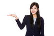 © leungchopan - Asian businesswoman with open hand palm