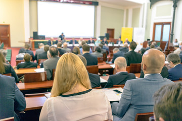 people sitting rear at the business conference