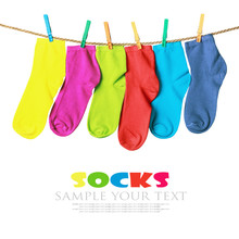 Colorful Socks Hanging On A Rope Isolated On White