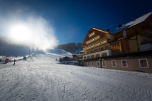 Ski Resort At Austrian Alps With Working Snow Cannons At Sunny D