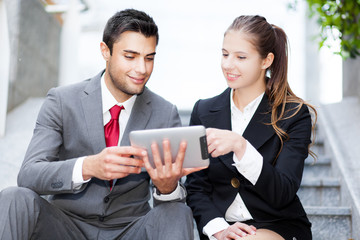 Wall Mural - Business people using a digital tablet