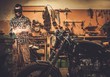 © Nejron Photo - Mechanic doing lathe works in motorcycle customs garage