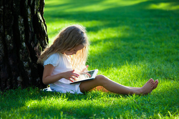 Sticker - Child with tablet pc outdoors