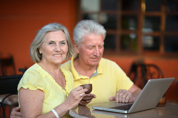 Sticker - couple sitting with laptop 