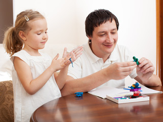 Wall Mural - Girl and dad molded from clay toys