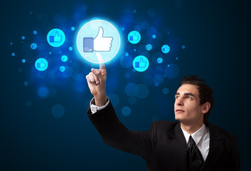 Poster - Handsome person pressing thumbs up button on modern social netwo