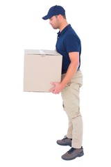 Wall Mural - Side view of delivery man carrying cardboard box