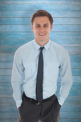 Poster - Happy businessman standing with hands in pockets