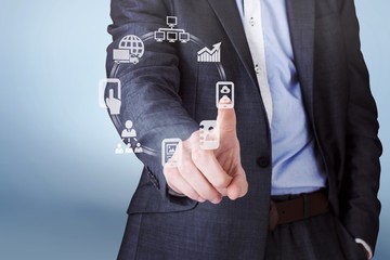 Poster - Composite image of businessman in grey suit pointing
