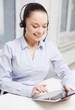 © Syda Productions - friendly female helpline operator with tablet pc