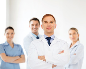 Canvas Print - smiling male doctor in white coat