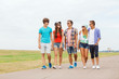 © Syda Productions - group of smiling teenagers walking outdoors
