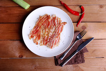 Strips Of Bacon In White Plate With Spices, Shallot And Chili