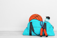Sports Bag With Sports Equipment In Room