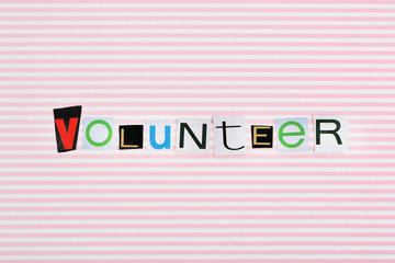 Wall Mural - Inscription volunteer on colorful background