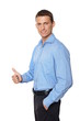 © petrdlouhy - Young smiling businessman in blue shirt showing thumb up