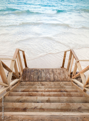 Naklejka ścienna Empty wooden stairs goes to the sea