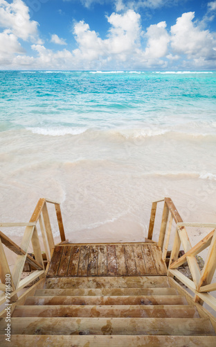 Obraz w ramie Empty wooden stairs goes down to ocean coast